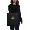 Black organic cotton tote bag with embroidered Plant Resistance calendula design. Schwarze Bio-Baumwolltasche mit gesticktem Plant Resistance Ringelblumen-Design.
