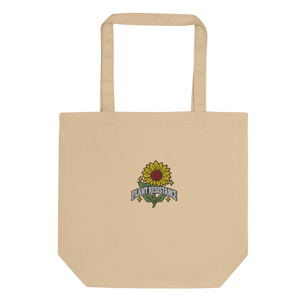 Stone organic cotton tote bag with embroidered Plant Resistance sunflower design. Bio-Baumwolltasche mit gesticktem Plant Resistance Sonnenblumen-Design.